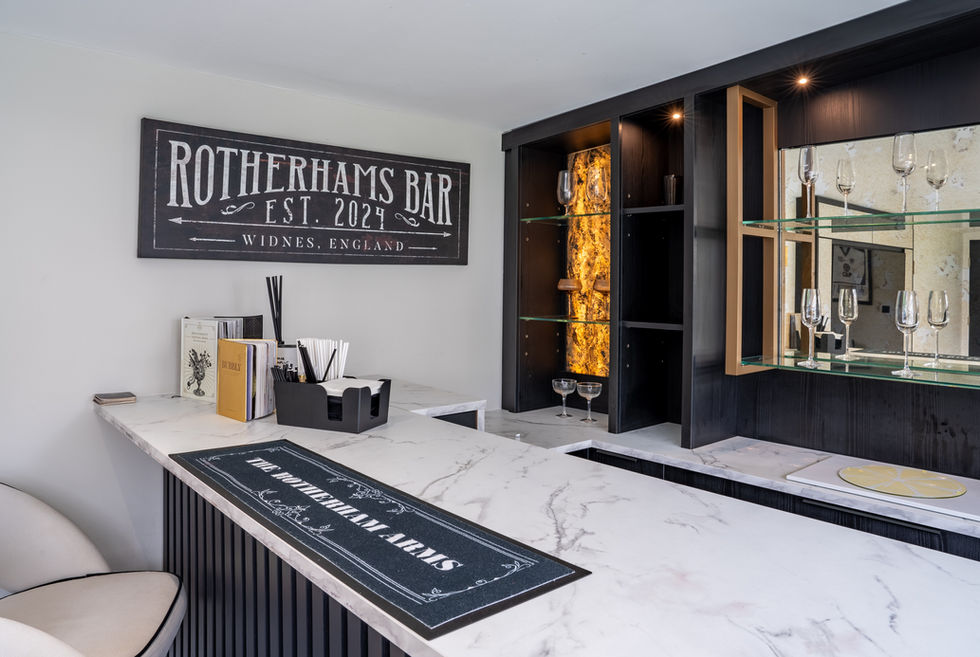 Modern bar interior with marble counter and signage.