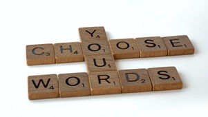 Scrabble letters spelling "Choose Your Words." Photo by Brett Jordan on Unsplash.