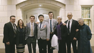 Friends gather with Lui Fangbo in front of the Provo City Center Templethe temple.