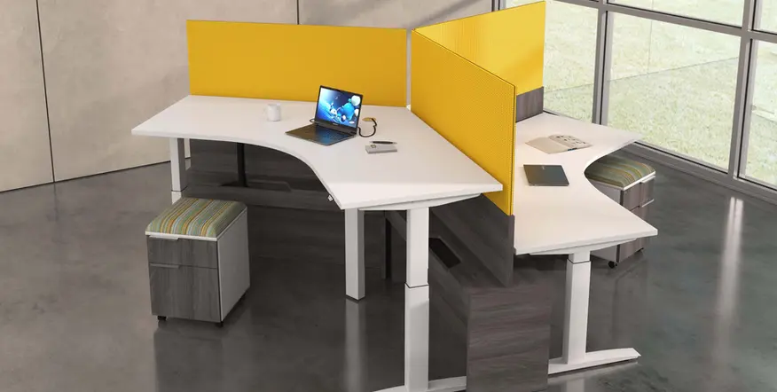 Modern office workspace with yellow dividers, laptop, and office furniture. Austin