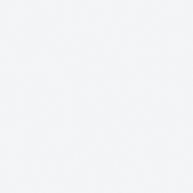 White pixels forming a subtle pattern in a pale, monochromatic background.