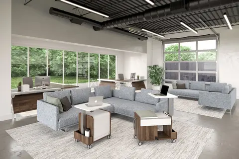 Modern office furniture arrangement: sofas, desks, and tables
