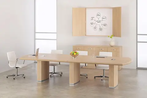 Modern conference table with chairs and whiteboard