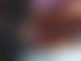 A wireless system attached to the side of someone's leg, against a blurred background