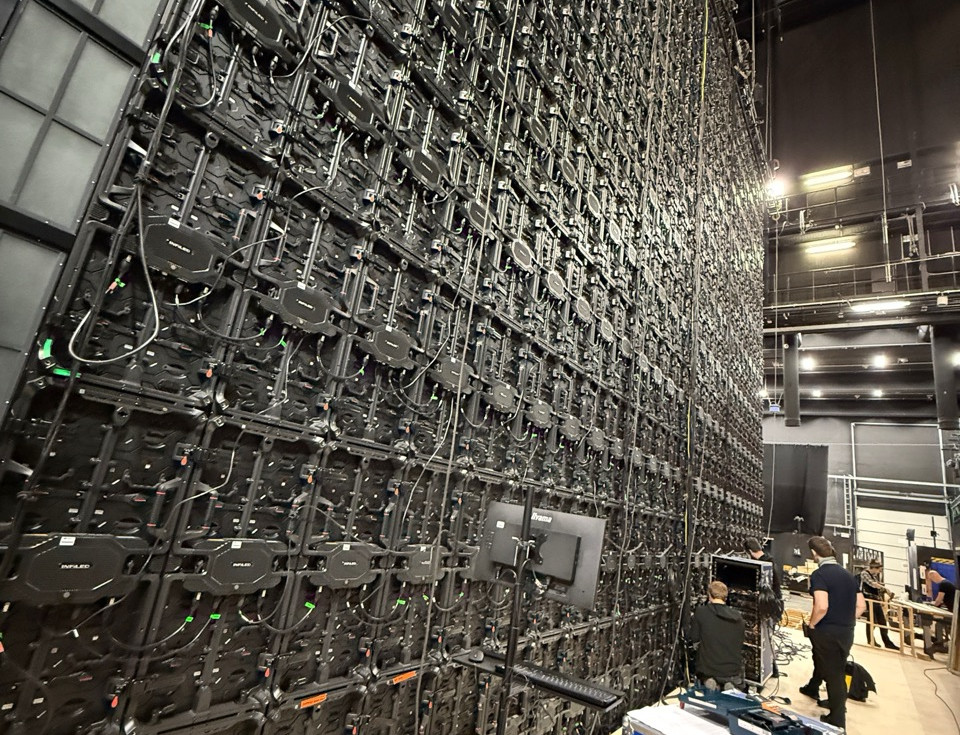 A large wall of black electronic equipment