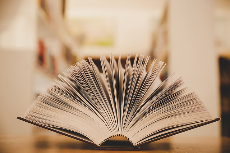 opened-book-on-the-desk-and-isle-of-book