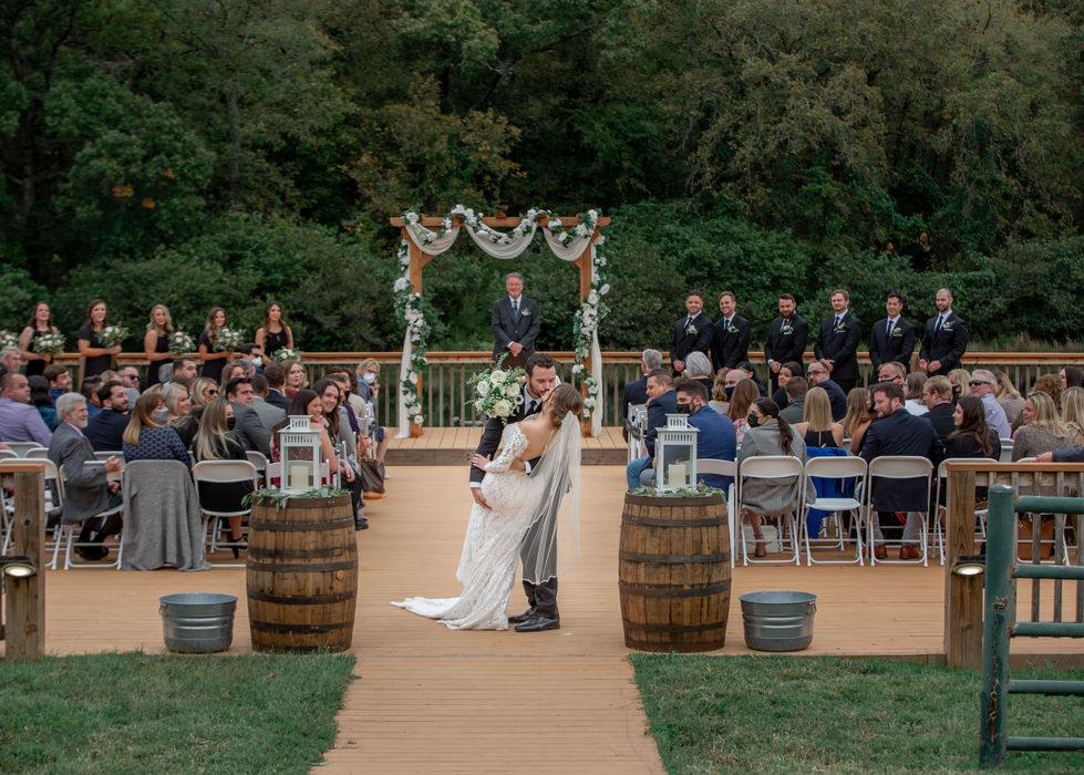 Wedding guests cheering after the couple's first kiss