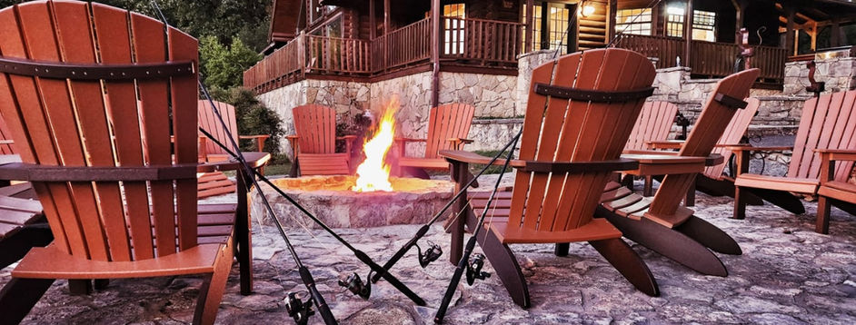 Luxury hunting lodge exterior with stone and wood construction at Cedar Cove Ranch