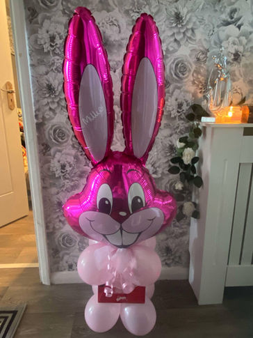 A large pink foil bunny balloon