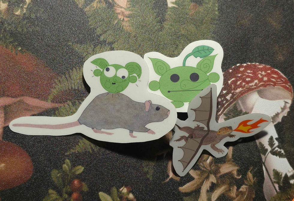 A goblin bouncing on a rat, a goblin with a leaf coming out of it's head, and a bearded dragon with flames.
