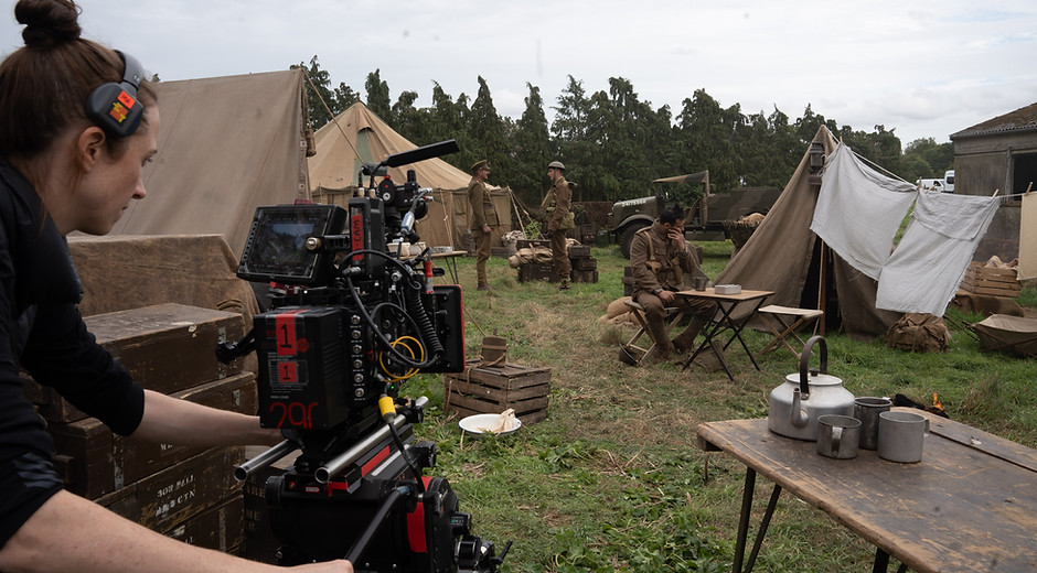 Woman holding a camera on a film set