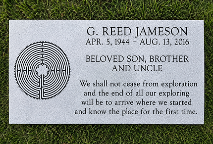 Flat granite grave marker with custom engraved design and inscription