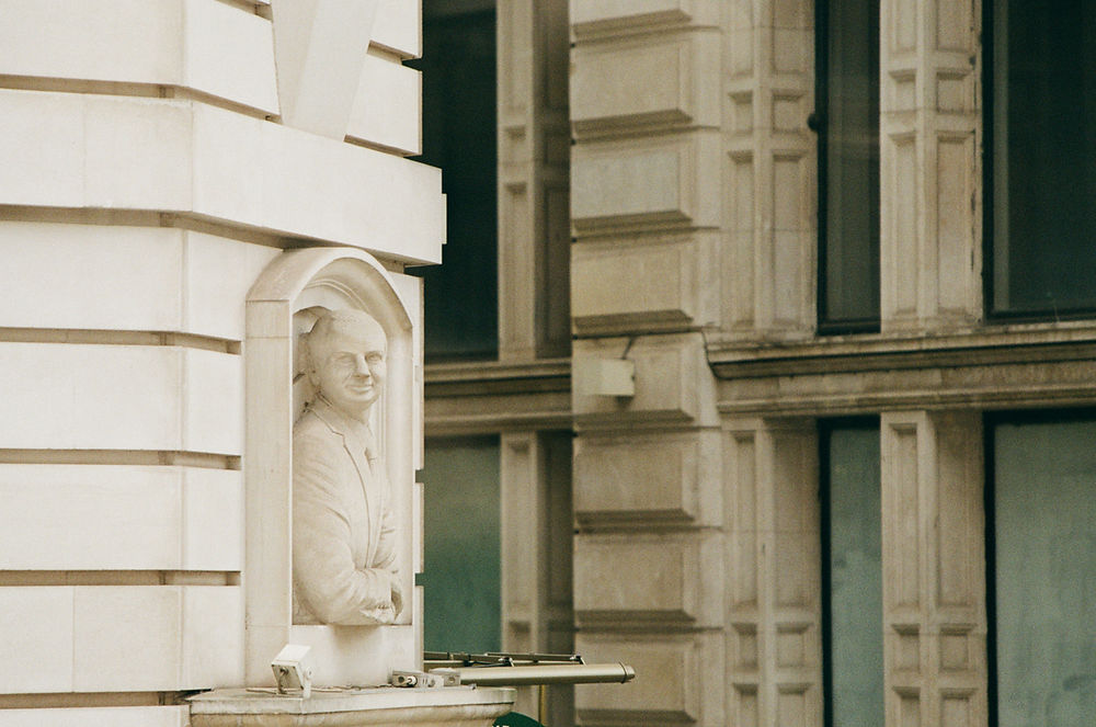 Statue in a London street photography architectural niche.