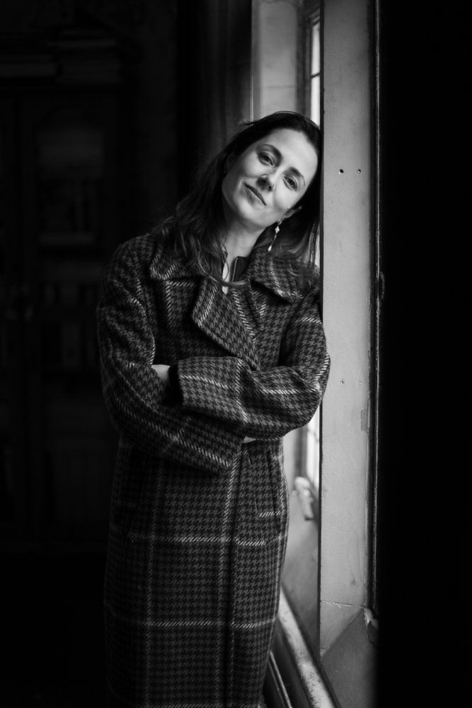 Woman in plaid coat by performance photographer London