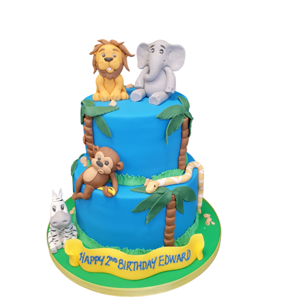 Bespoke celebration cake in Solihull, West Midlands featuring detailed safari animal toppers and jungle foliage decorations.