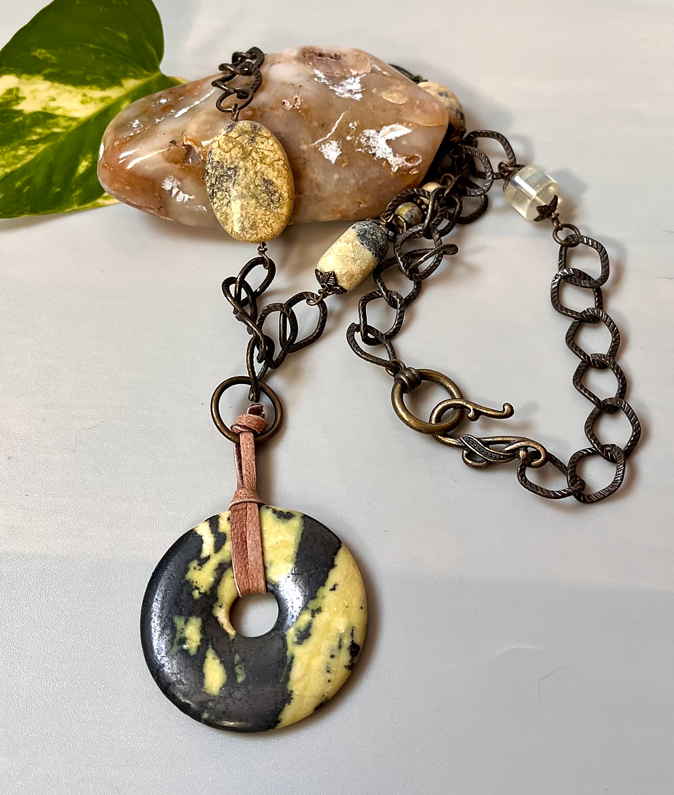 Miniature : Handmade necklace with unique pendant and Copper Leaf Lariat Necklace display on stone