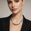 Thumbnail: Woman wearing turquoise beaded necklace with black blazer, looking at the camera.