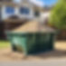 sandpile next to a large metal skip bin on a residential budling site.jpg