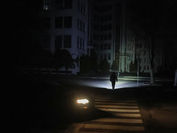a person walking with a torchlight Ukraine