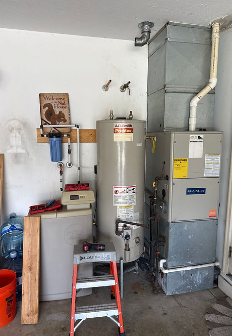 Gas water heater and furnace in a garage utility area