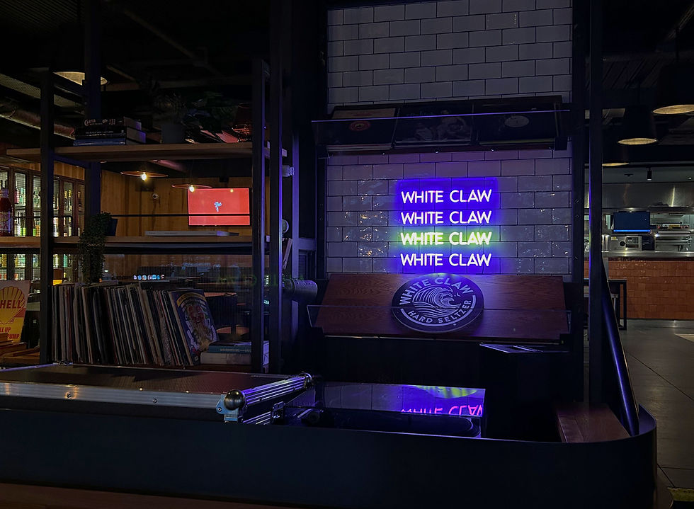 white-claw-neon-sign-behind-bar.jpg