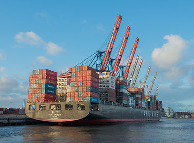 Container ship arriving at a U.S. port with European imports, supporting international logistics and global trade