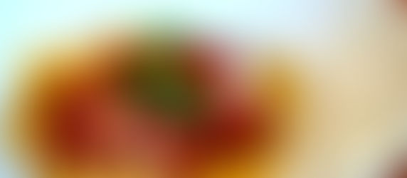 An elegant plate of braised short rib and ricotta-stuffed ravioli