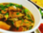 A glistening bowl of duck noodle soup in a rich dark brown broth from Elephant Thai in South Charleston