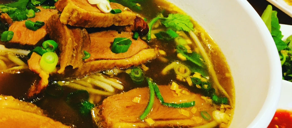 A bowl of duck noodle soup in a rich dark brown broth from Elephant Thai in South Charleston, WV