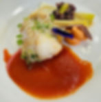 A dish of monkfish with creamy tomato sauce