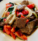 A plate of glazed sliced steak, onions, peppers and seasoning from Chow Thai in Charleston, WV