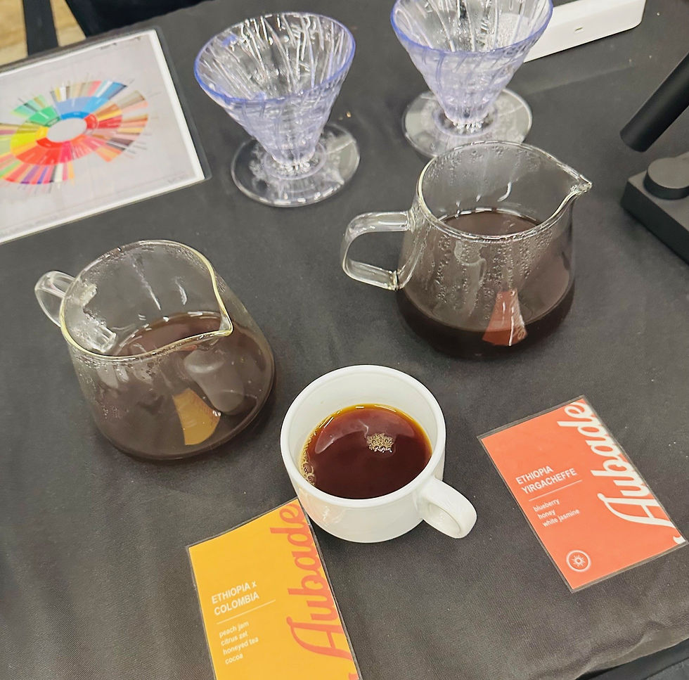 A cup of coffee sits on a table at a coffee festival