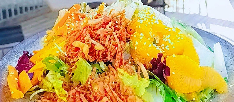 A giant plate of salad full of fresh vegetables