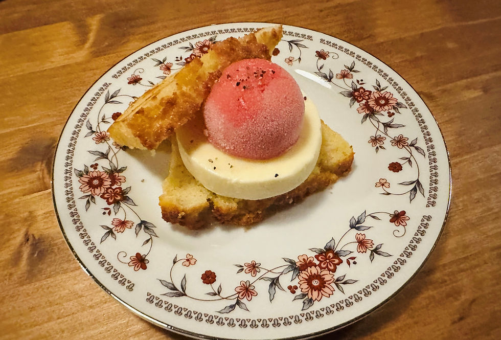 A tomato and mayo "sandwich" dessert on a plate features salt-rising bread, mayo ice cream and farm tomato sorbet