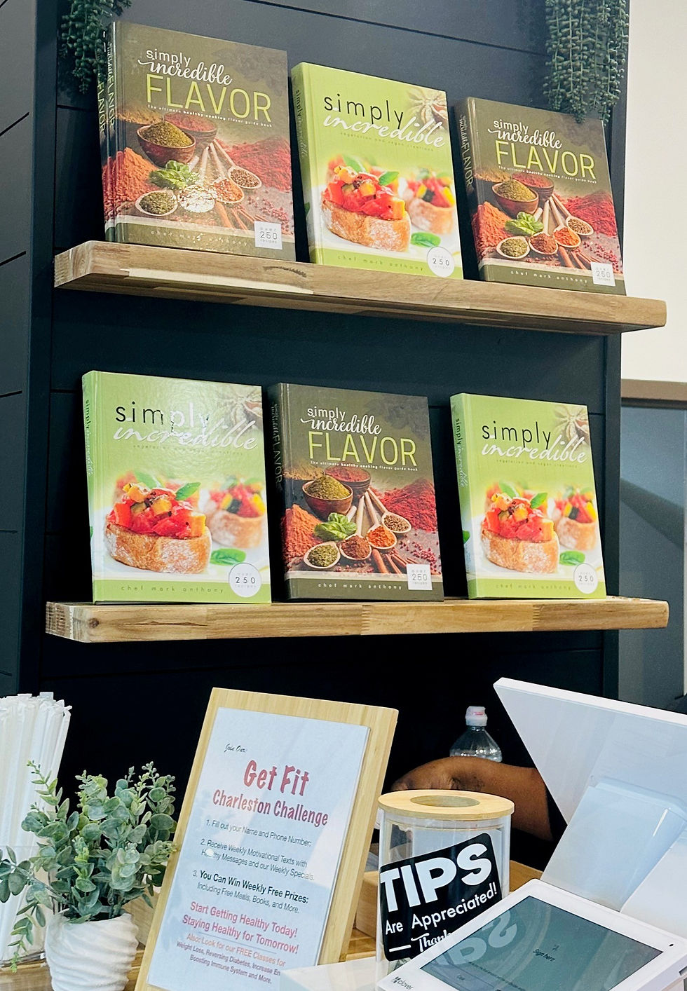 Shelves with healthy food cookbooks by Chef Mark Anthony are displayed for purchase at Haystax restaurant in Charleston, WV