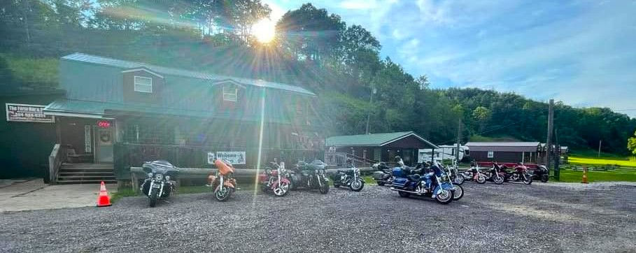 A sports bar with motorcycles lined up outside
