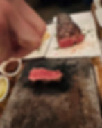 Cooking steak on a stone, tableside