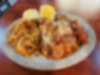 A large plate of spaghetti, lasagna and cheese manicotti with garlic bread from Milano's Italian Restaurant in Charleston, WV