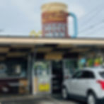 A giant mug of root beer spinning on top of a historic drive-in