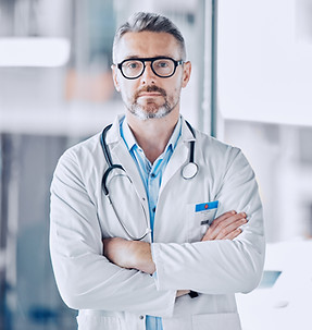 Mature doctor man, arms crossed and portrait for leadership in hospital, medical research 