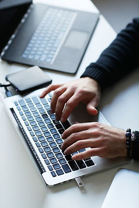 Man hands typing on laptop photo by digital topguns
