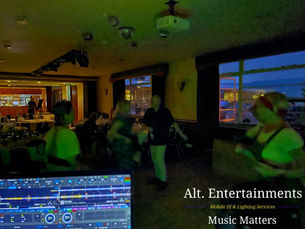 A lively disco scene at Sywell Aerodrome in Northamptonshire for The Classic Corvette Club, showing guests dancing energetically under colorful lights. The photo, taken by Alt. Entertainments, captures the dynamic atmosphere of the event organized by the Mobile DJ, Disco, and Events Company.
