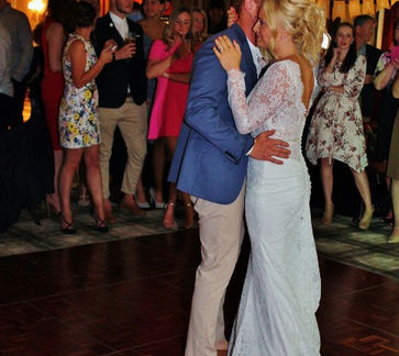 A magical moment as the bride and groom share their first dance at Beau Desert Golf Club in Cannock, Staffordshire, surrounded by family and friends.