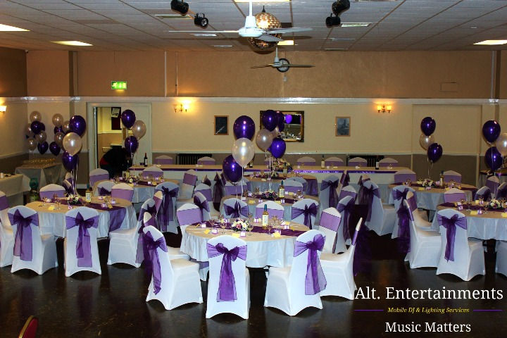 A beautifully decorated wedding venue in Bilston, Wolverhampton, featuring elegant table settings, floral arrangements, and ambient lighting. Photo taken by Alt. Entertainments, a mobile DJ, disco, and events company.