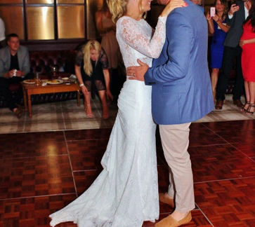 Newlyweds sharing their first dance at Beau Desert Golf Club in Cannock, Staffordshire, surrounded by joy and romance.