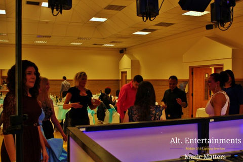 A lively dance floor comes to life at the Wellington Civic & Leisure Centre in Telford, Shropshire, captured in this dynamic photograph by Alt. Entertainments, a trusted Wedding DJ/Mobile DJ, Disco & Events Company.