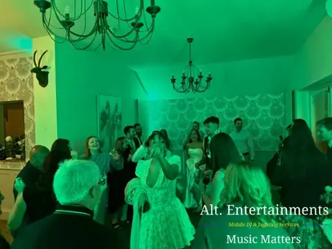 Wedding guests celebrating on the dance floor at St. John’s House in Lichfield, Staffordshire, with music and entertainment provided by Alt. Entertainments Wedding DJ and Mobile DJ services.