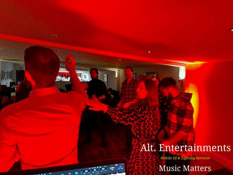 Guests dancing energetically at a disco event at Ormskirk Cricket Club. The photo, taken by Alt. Entertainments, showcases a lively dance floor with vibrant lighting, reflecting the dynamic and enjoyable atmosphere created by the mobile DJ, disco, and events company.