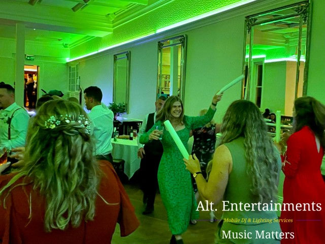 A jubilant crowd fills the dance floor at a wedding held at Pendrell Hall in Codsall Wood, Staffordshire. Captured by Alt. Entertainments, renowned for their Wedding DJ/Mobile DJ, Disco & Event Services, the photo exudes joy and celebration.