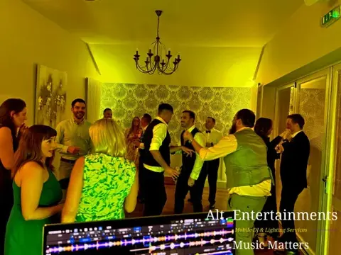 Guests dancing at a wedding party at St. John’s House in Lichfield, Staffordshire, with music and entertainment provided by Alt. Entertainments Wedding DJ and Mobile DJ services.